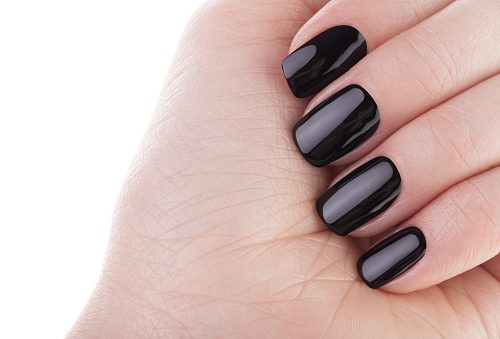 Very beautiful black nails close up.